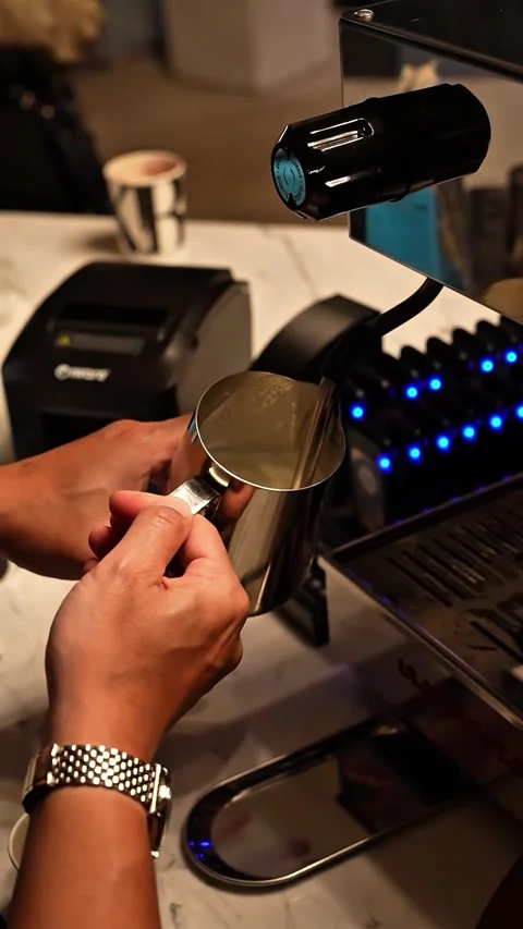Steaming milk for latte coffee from a coffee machine with a horizontal view Video stock 301747990