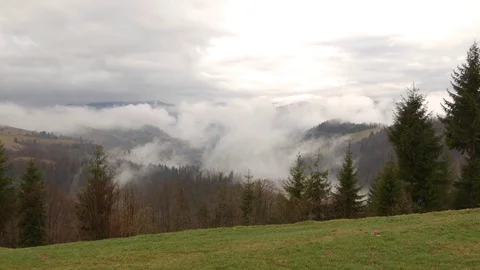 Steaming mountains. Steam comes from the slopes of the mountains after the rain. Stock Footage 76444962