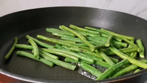 Steaming or Boiling Long String Beans in a Pan Stock Footage 234882140