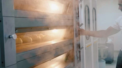 Steaming oven with fresh bread at commercial kitchen. Stock Footage 91317618