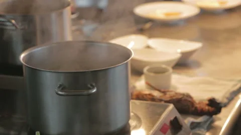 Steaming pot of food in a professional kitchen Stock Footage 58443271
