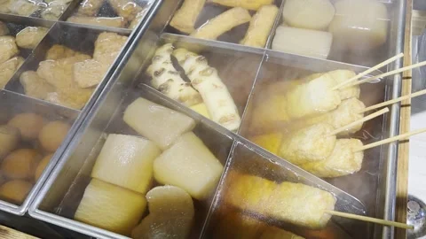 A steaming pot of oden with assorted ingredients. Stock Footage 323865113