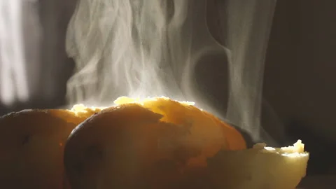 Steaming potato in backlight detail 2 100fps Stock Footage 151849636