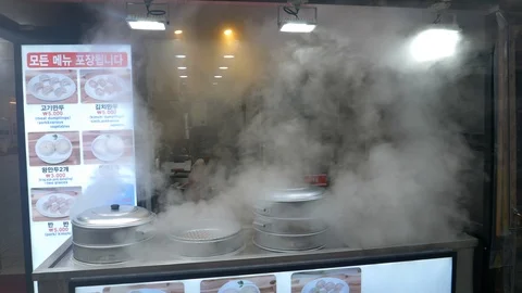 Steaming pots of dumplings Stock Footage 94852178