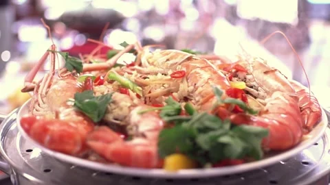 Steaming prawns in restaurant Stock Footage