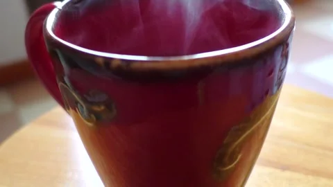 Steaming red cup (slow motion) Vídeos de archivo 151924535