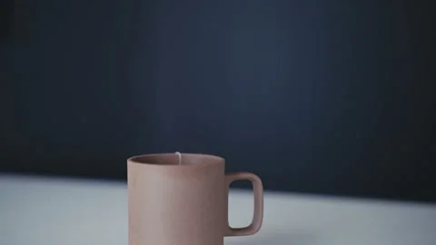 Steaming rising from a hot cup of tea Video stock 165767021