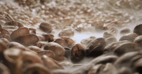 Steaming roasted coffee beans background with selective focus. Stock Footage 343405949