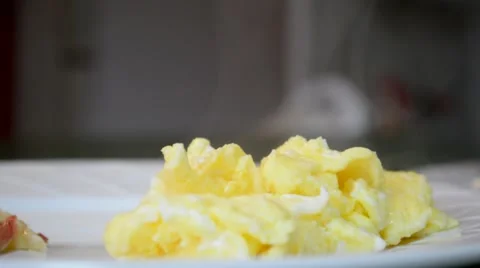 Steaming Scrambled Eggs on White Plate Stock Footage 46627190
