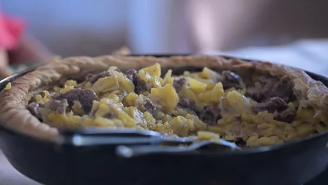 Steaming shepherd's pie cooling down on table Stock-Footage 305937731