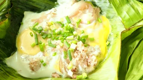 Steaming sour minced pork and egg in banana leaves, Thai northern food. Stock-Footage 197546296