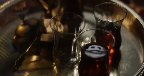 Steaming tea in oriental setting vibrating slightly Stock Footage 102965631