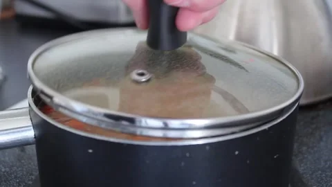 Steaming Vegetable Soup on Stovetop Stock Footage 264702955