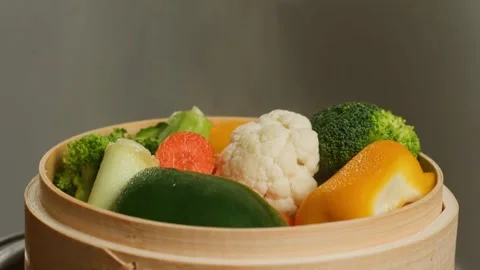 Steaming vegetables in bamboo steamer. Stock Footage 305808063