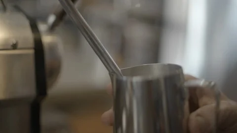 Steaming wand laying on coffee machine grid Stock Footage 87613059