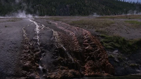 Steaming Water Running Down Volcanic Rock Stock Footage 86756391