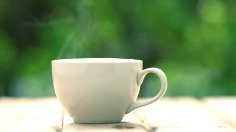 Steaming White Ceramic Coffee Mug: Peaceful Morning Atmosphere 4K Stockbeeldmateriaal 339275123