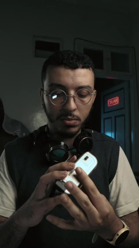 Steampunk Actor Examining Vintage Device Backstage Near On Air Sign Video stock 321679957