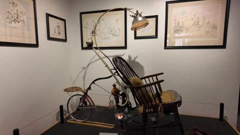 Steampunk art installation displays bicycle and chair. Stock Footage 345618938