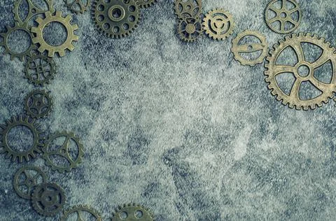 Steampunk background with different sized cogs and gears. Stock Photos