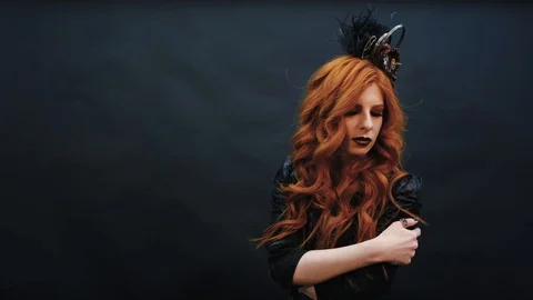 Steampunk gothic girl poses for the camera in slow-mo shooting Stock Footage 126525433