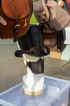 Steampunk Leather Top Hat with Goggles and Handmade Leather Bags Display Stock Photos
