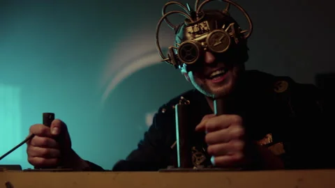 Steampunk man operating a machine Video stock 259857901