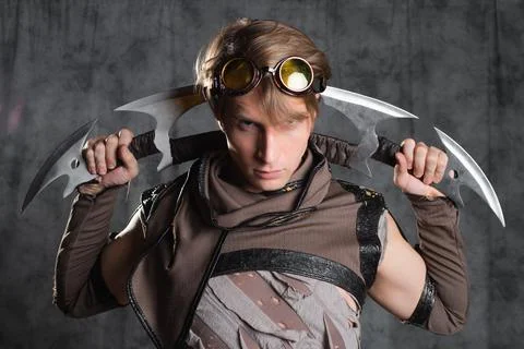 Steampunk or post-apocalyptic style character, with an unusual cold weapon Stock Photos