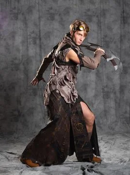 Steampunk or post-apocalyptic style character, with an unusual cold weapon Stock Photos