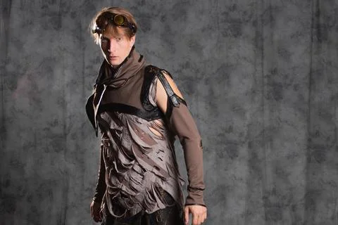 Steampunk or post-apocalyptic style character, a young man in a grunge suit. Foto stock