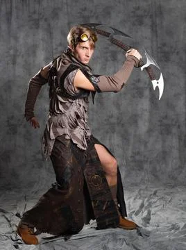 Steampunk or post-apocalyptic style character, with an unusual cold weapon Stock Photos