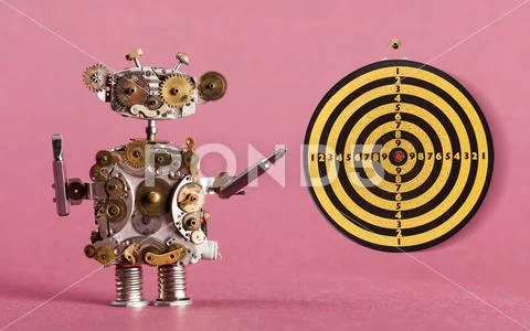 Steampunk robot handyman with screw drivers and dart board, vintage yellow black Stock Photos