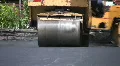 Steamroller flattens asphalt. HD Footage