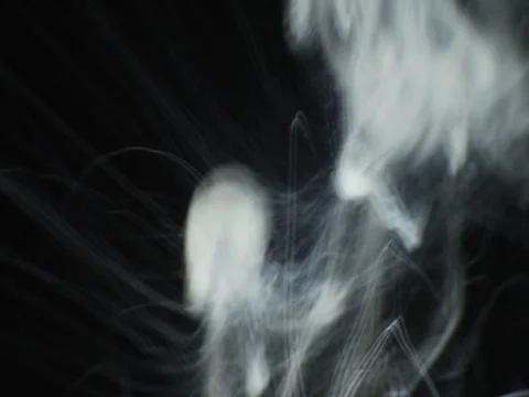 Steam(smoke) rise motion on black background. VFX element Stock Footage
