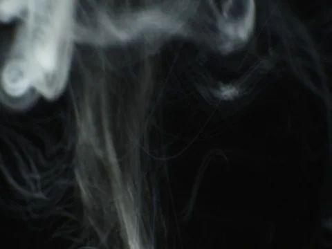 Steam(smoke) rise motion on black background. VFX element Stock Footage