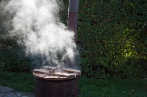 Steamy rusty cauldron Stock Photos