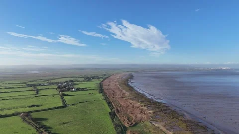 Steart fields and Bridgewater Bay to Hinckley Point Aerial pan Stockbeeldmateriaal 294017452