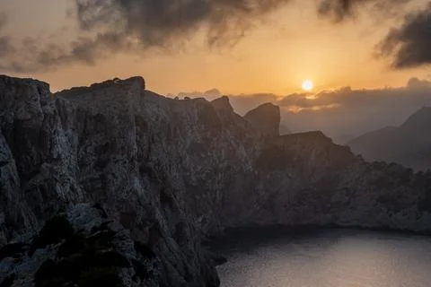 Steef cliff and sharp crest with sunset light Stock Photos