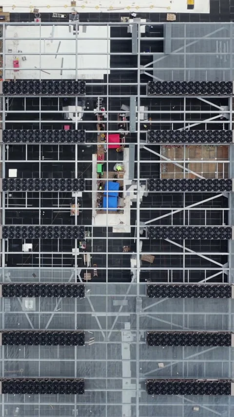 The steel and equipment grid of a data center roof under construction fills the Stock Footage 345728284