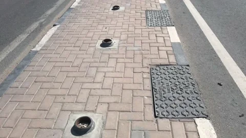 Steel bollards fixed in an interlock paving platform as barrier Stock Footage 169813538