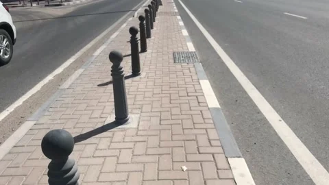 Steel bollards fixed in an interlock paving platform as barrier Stockbeeldmateriaal 169813619