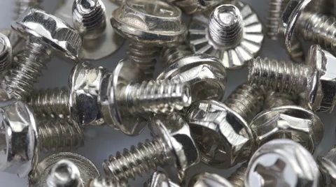 Steel bolts turning in a seamless loop Stock Footage 40052228