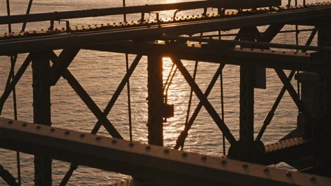 Steel Bridge Structure with Sunrise Reflection on Water Stock Footage 309860604
