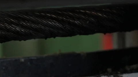 Steel cable oiled fed into machine Stock Footage 77052614