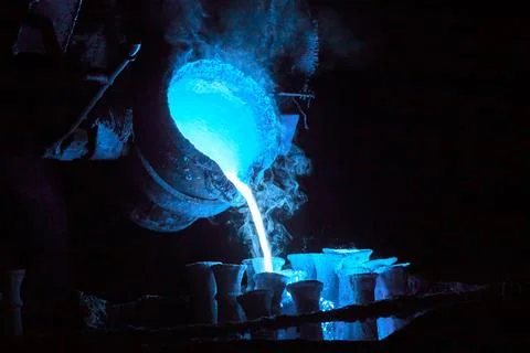 Steel casting process toned blue for magic potion or chemical or biohazard .. Stock Photos