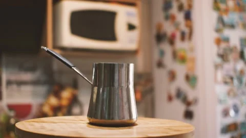 Steel cezve on the background of the kitchen interior Stock Footage 160430704