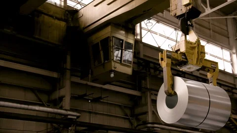 Steel Crane in Modern Mill moving roll of steel Stock Footage 89944542
