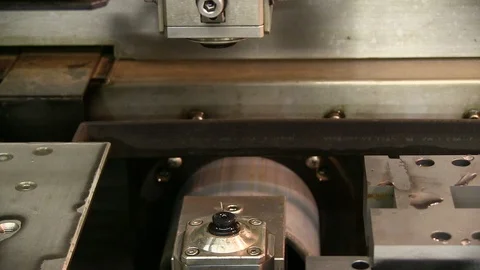 A steel cutting device sets a wire cutter with water at a tooling shop. Stock Footage 125867236