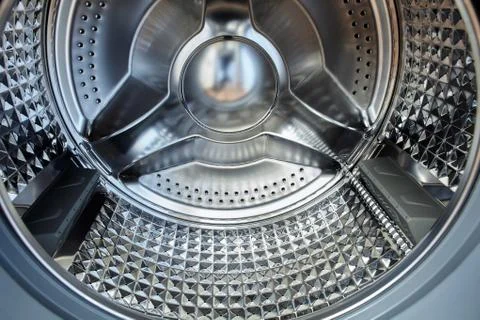 Steel drum automatic front-loading washing machine. Stock Photos
