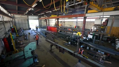 Steel Fabrication Workshop Interior With Workers Handling Structural Metal Beams Stock Footage 330805691